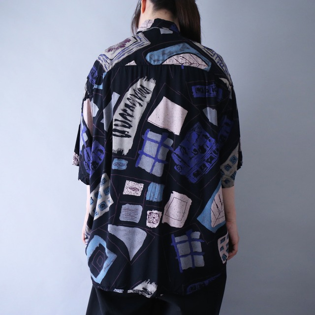 dark coloring full art pattern over silhouette h/s shirt