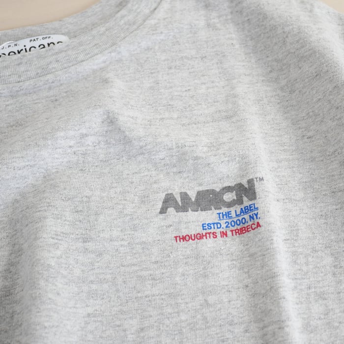 AMERICANA 後ろVネック丸胴 FOOT BALL TEE AMERICANA（アメリカーナ）の「AMERICANA アメリカーナ 後ろVネック丸