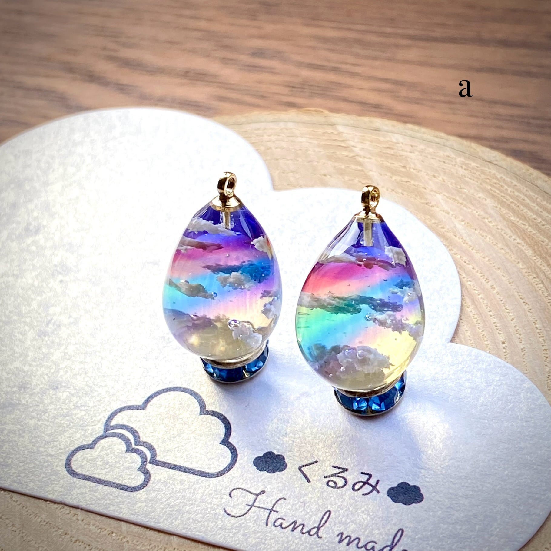 レジンピアス イヤリング 夕暮れ空にかかる虹 たまご型16×12mm a | PAY ID