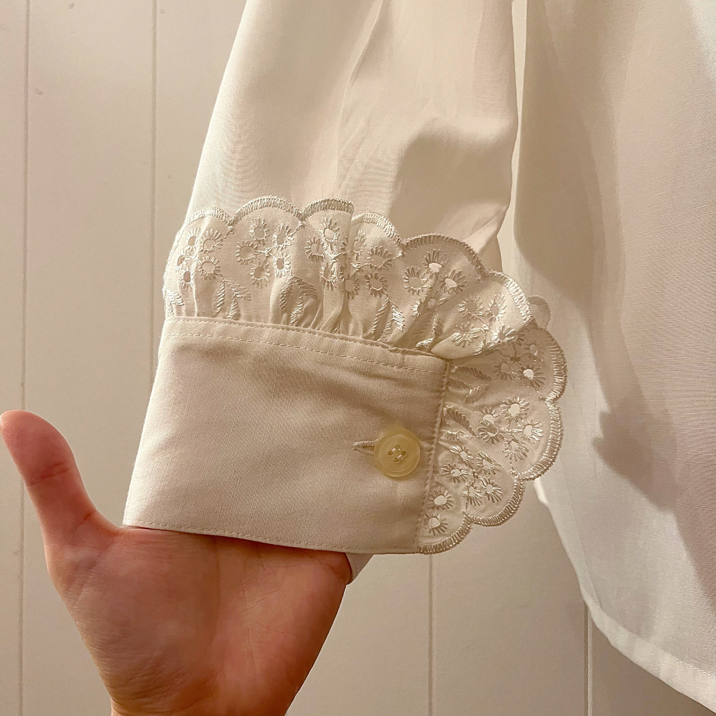 big frill cuffs white blouse