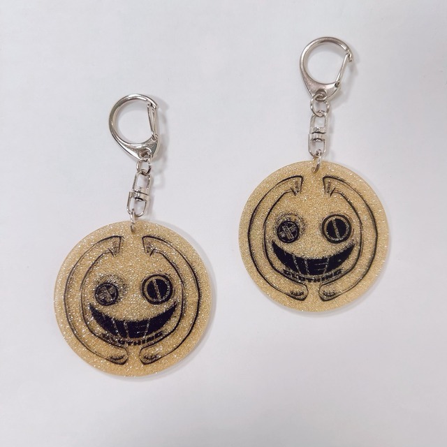 ゴールドグリッターアクリルキーホルダー【FACE LOGO】
