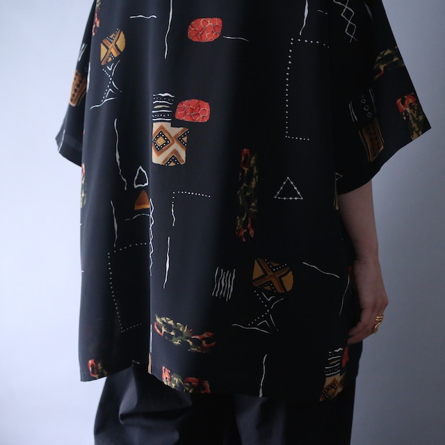 geometry art graphic pattern XXX over silhouette open collar h/s shirt