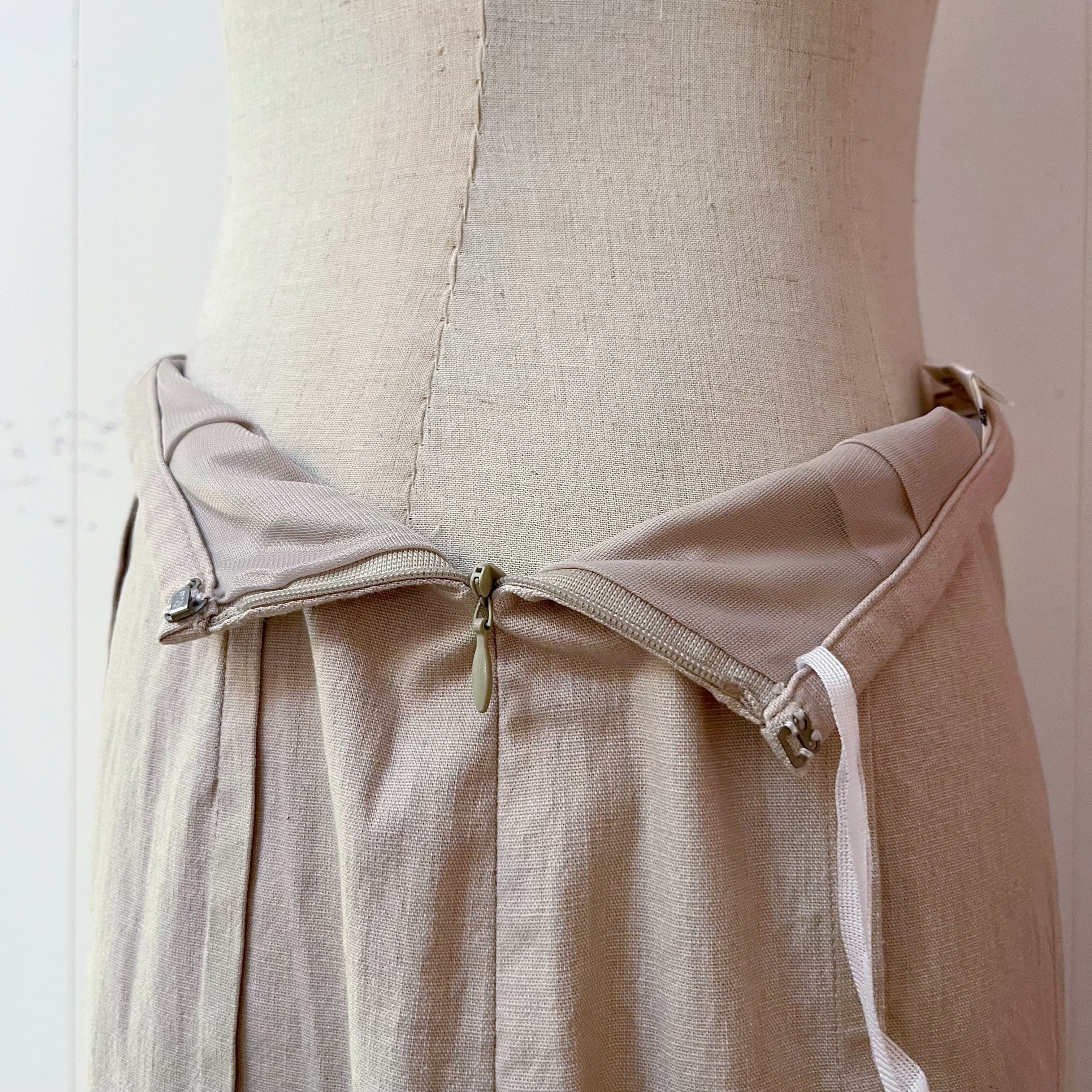 beige pleats side slit long skirt