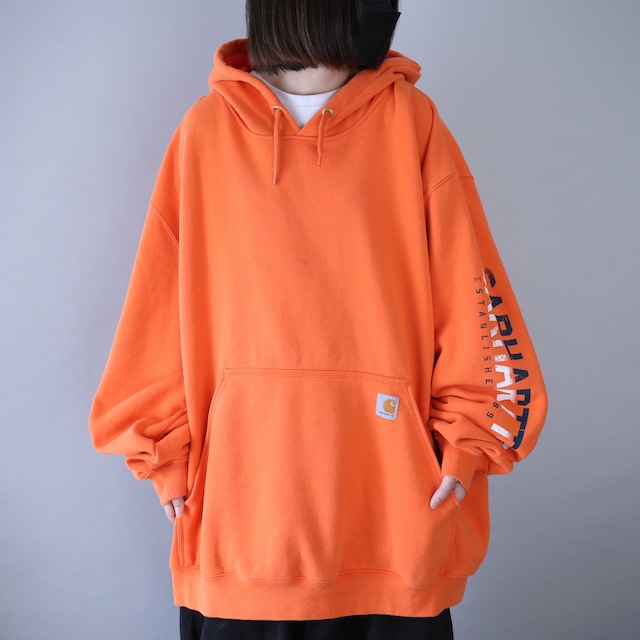 "Carhartt" sleeve logo printed XXXL over silhouette orange sweat parka