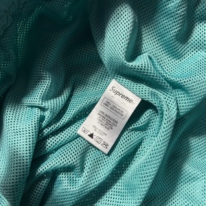SUPREME logo taping track pants