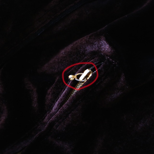 piping and gold zip and plate design over silhouette velours track jacket