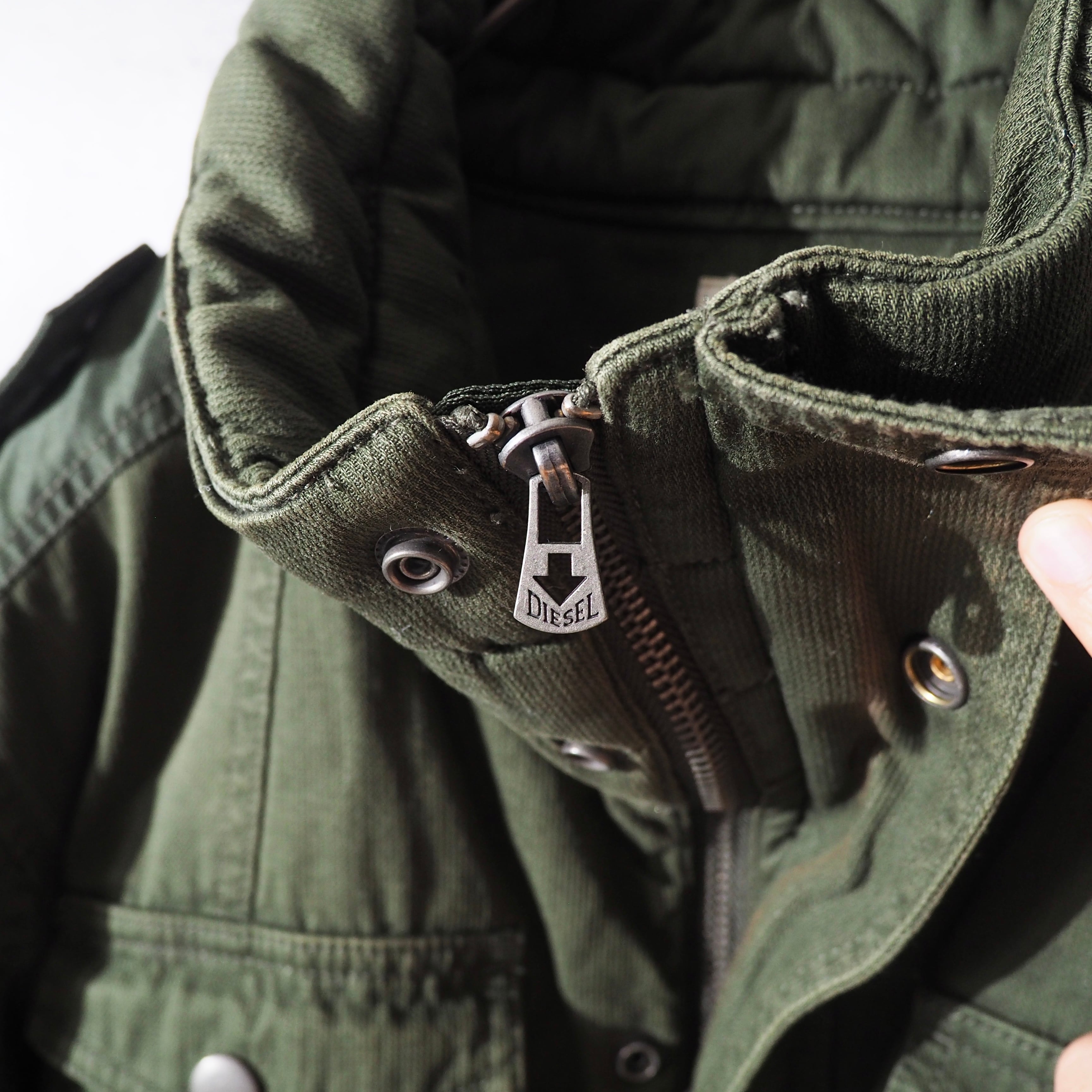 " DIESEL " Big Pockets × Switching nylon High neck Military jacket
