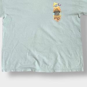 【Caribbean Soul】バックプリント Tシャツ 両面プリント イラスト コピーライト2002 X-LARGE ミント カリビアン 海 オウム ヨット 楽譜 ギター 地図 半袖 夏物 US古着