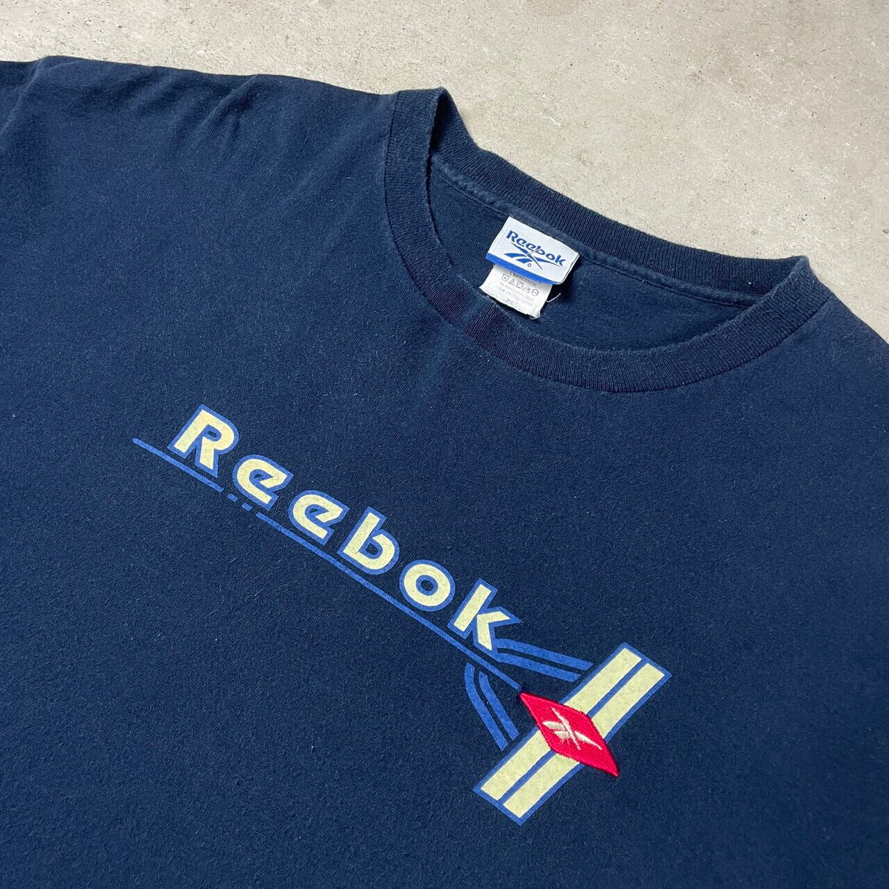 90年代 USA製 Reebok リーボック ロゴプリント 刺繍 Tシャツ メンズXL 古着 90s ビンテージ ヴィンテージ シングルステッチ  ネイビー 紺色【Tシャツ】【FSS2308-50b】 | cave 古着屋【公式】古着通販サイト