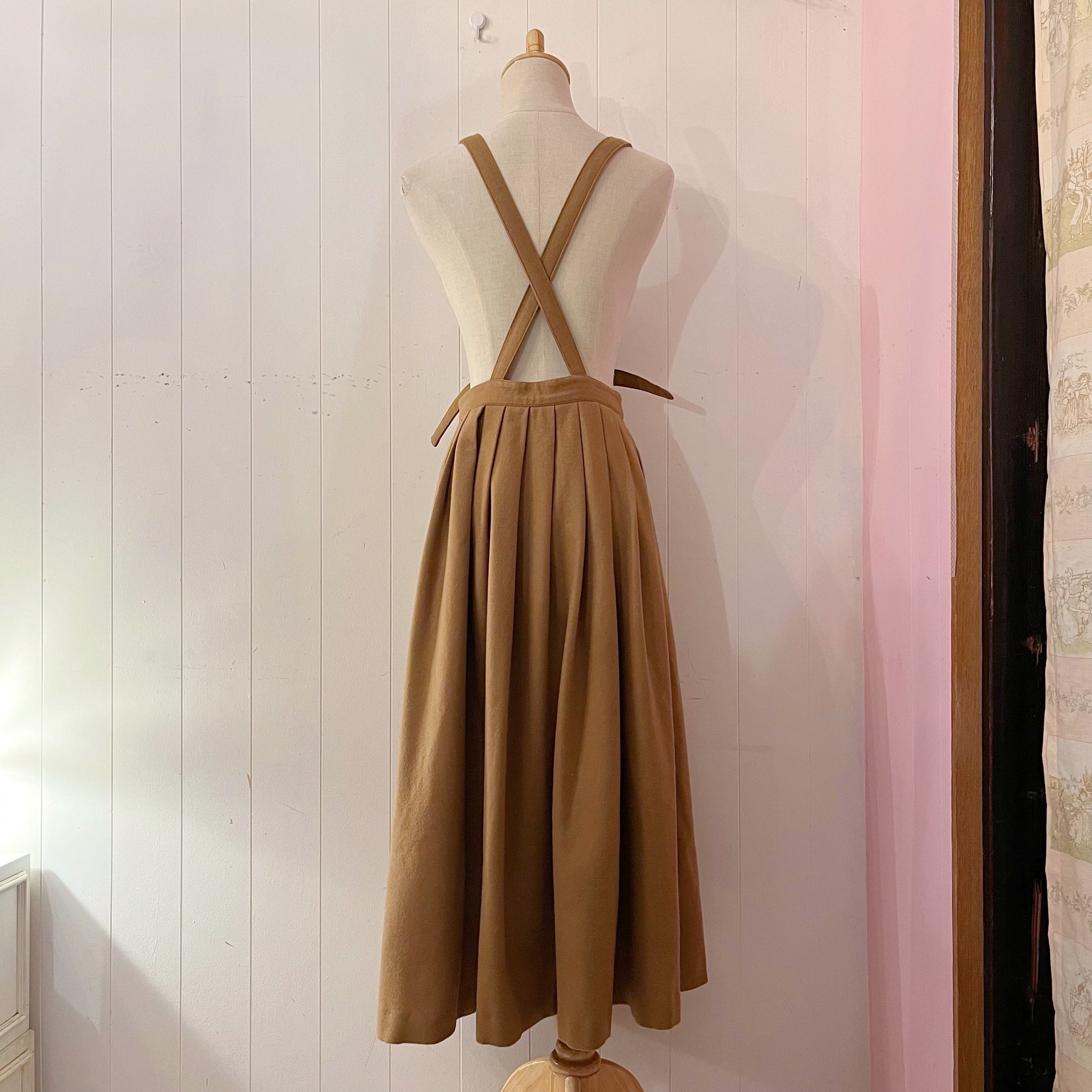 beige front button suspender skirt
