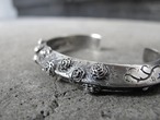 Silver rose bangle.