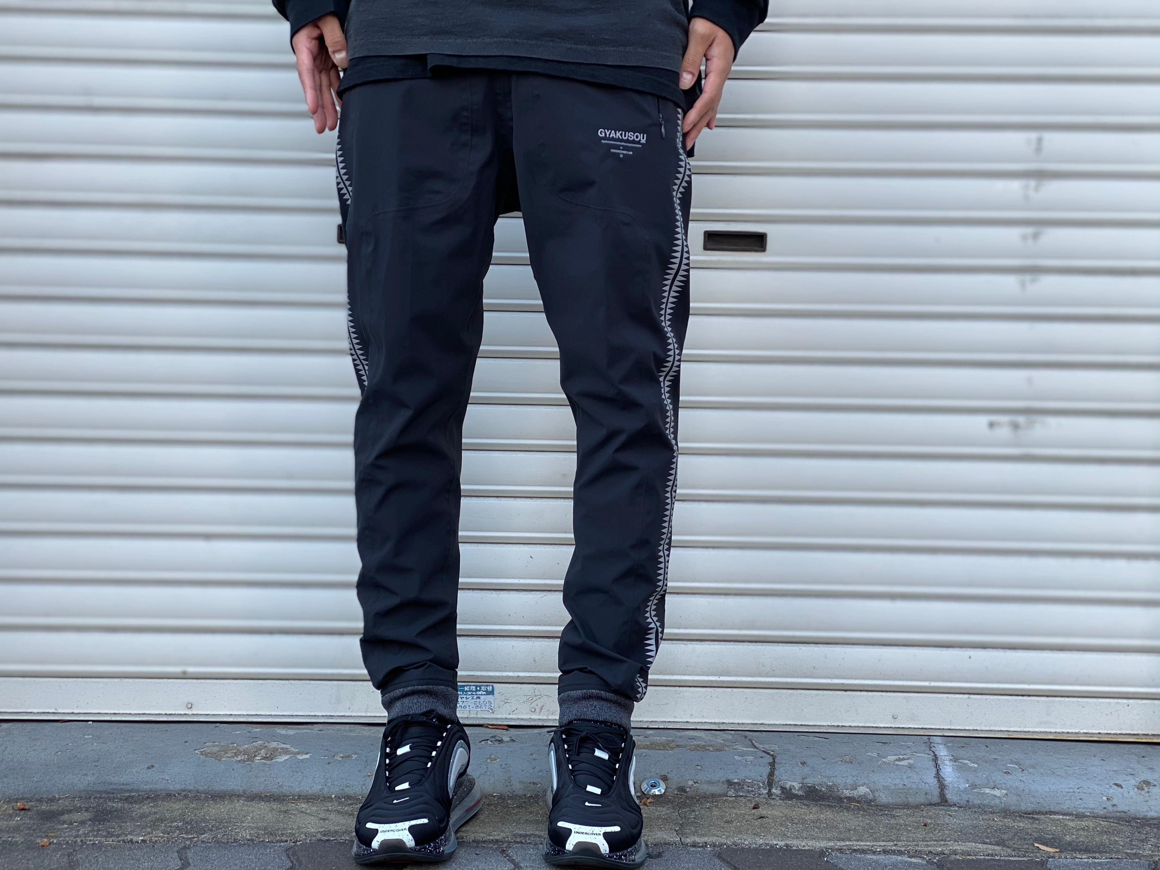 ナイキ ×アンダーカバー UNDERCOVER 842794-010/WR TEAM TRACK PANT BLACK ギャクソウGIZ柄ウォームアップトラックロングパンツ メンズ M