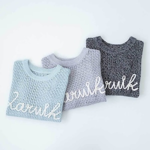 CLOCHE ラグラン袖ロゴニットプルオーバー