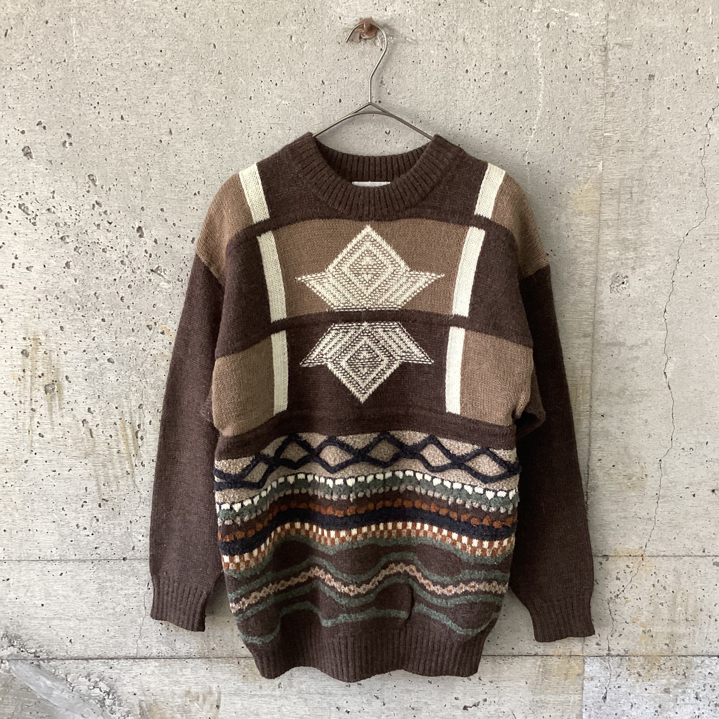 brown three-dimensional knitted sweater