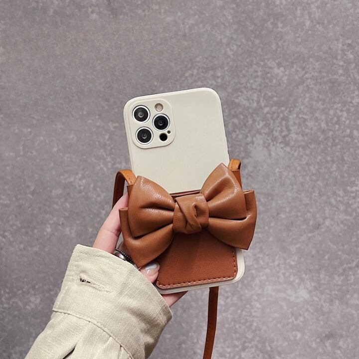 スマホケース iPhoneケース スマホカバー アイフォンケース レディース 斜めがけ 斜め掛け ストラップ 落下防止 ホルダー リボン 蝶結び かわいい 大人可愛い シンプル カジュアル 上品 清楚 フェミニン おしゃれ お洒落 綺麗 お嬢様 おとな ナチュラル こなれ感 ラフ ラブリー キュート ガーリー ヴィンテージ 無地 OL 通勤 学生 通学 デート お出かけ 女子会 休日 パーティー イベント カフェ巡り 送料無料 ブラウン 10代 20代 30代 ギフト プレゼント お揃い インスタ映え