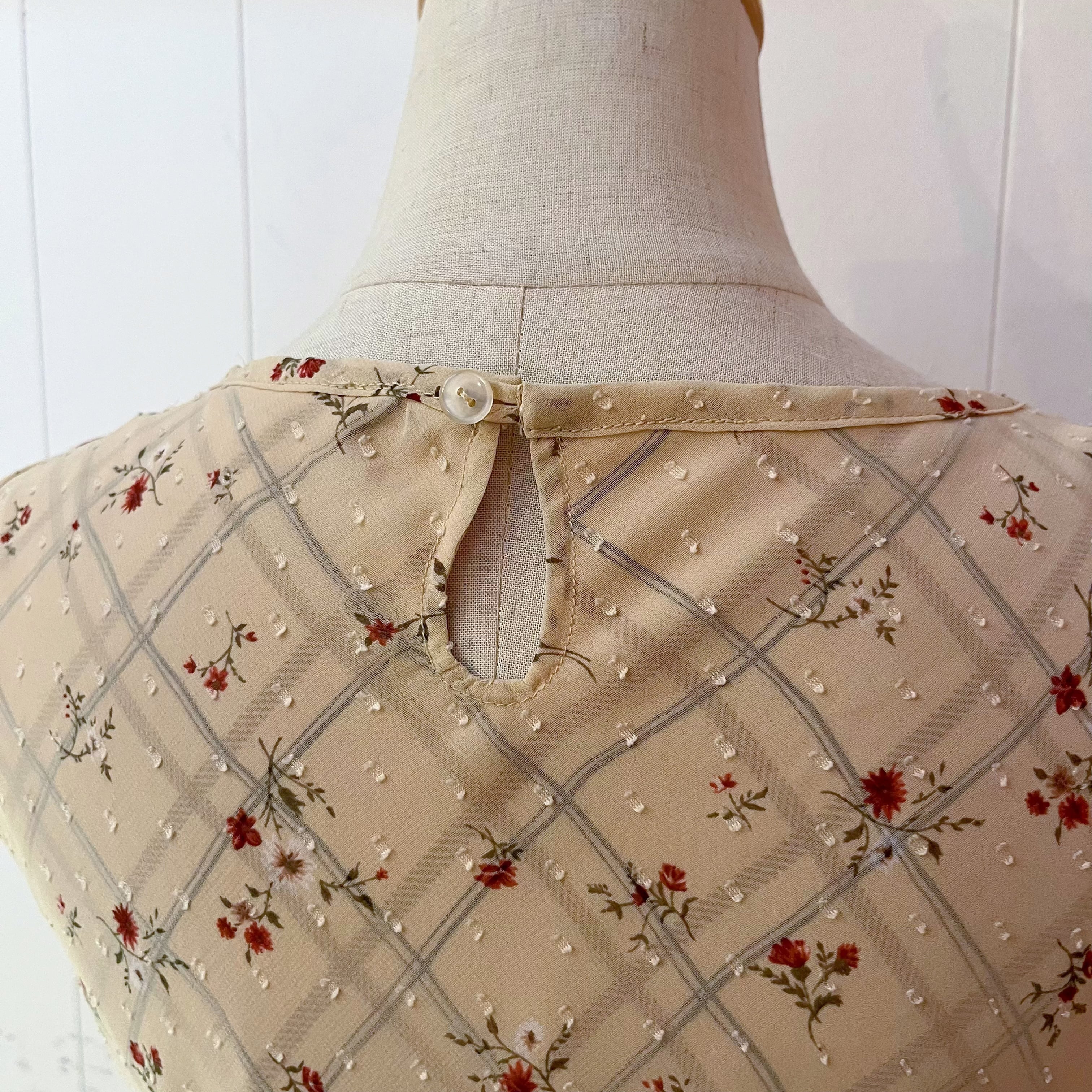 flower check sleeve less one-piece