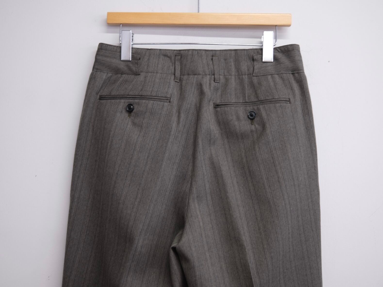 ULTERIOR” MELANGE HERRINGBONE STRIPE TUCKED TROUSERS” | Lapel
