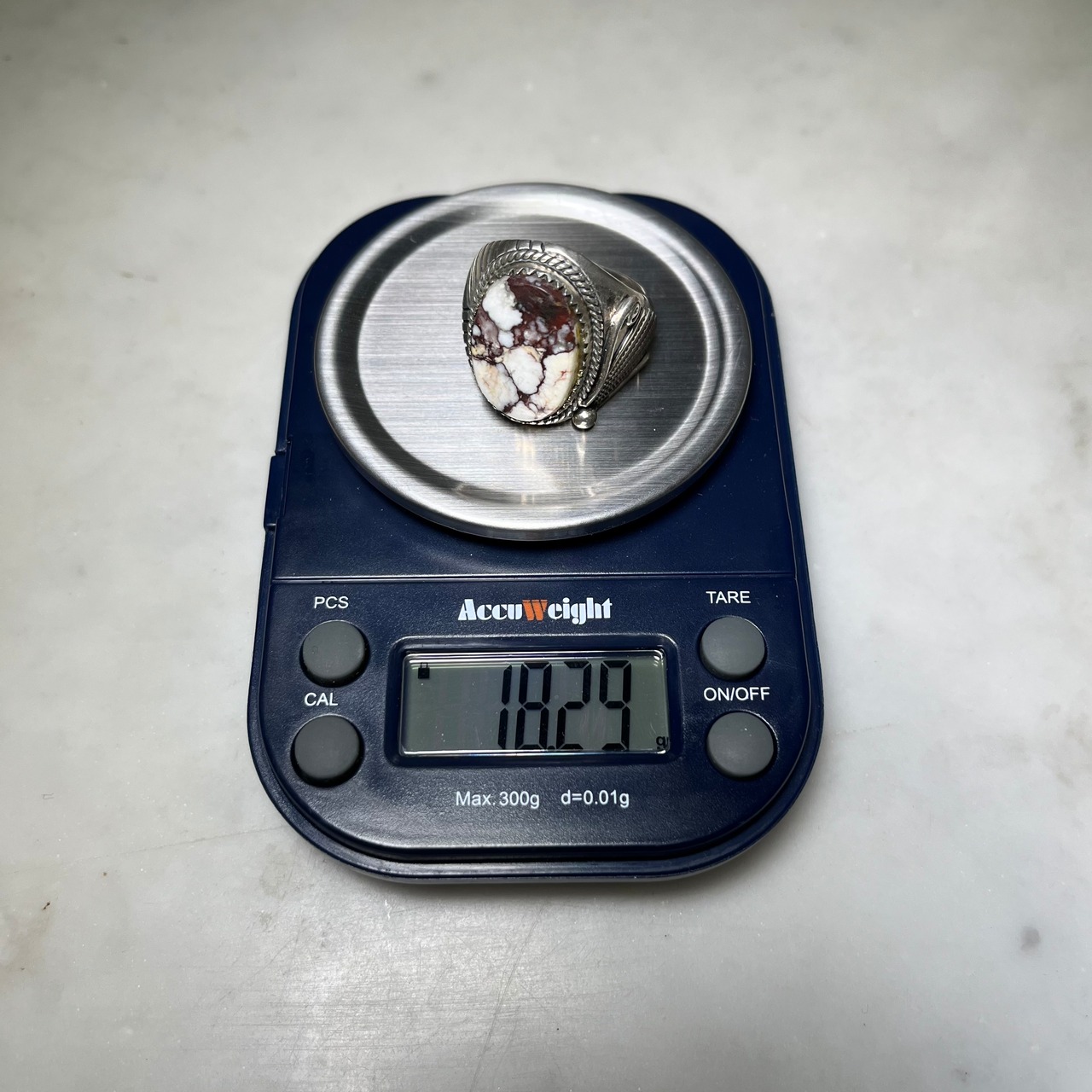 Orville White silver ring set with white buffalo