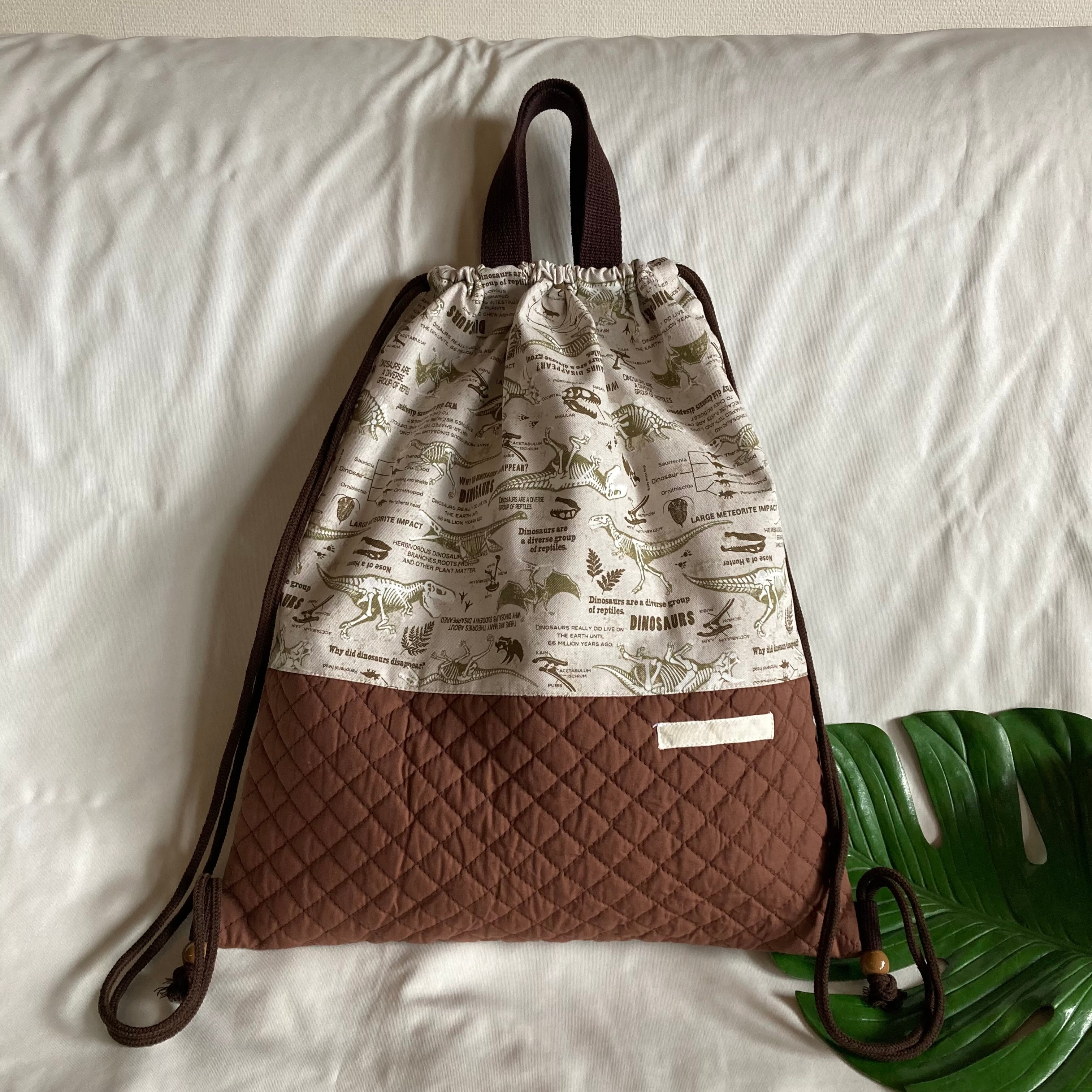 レッスンバッグ　絵本袋　ポケット付き　恐竜化石　アイボリー×黒　茶 レッスンバッグ絵本袋ポケット付き恐竜化石アイボリー×黒茶