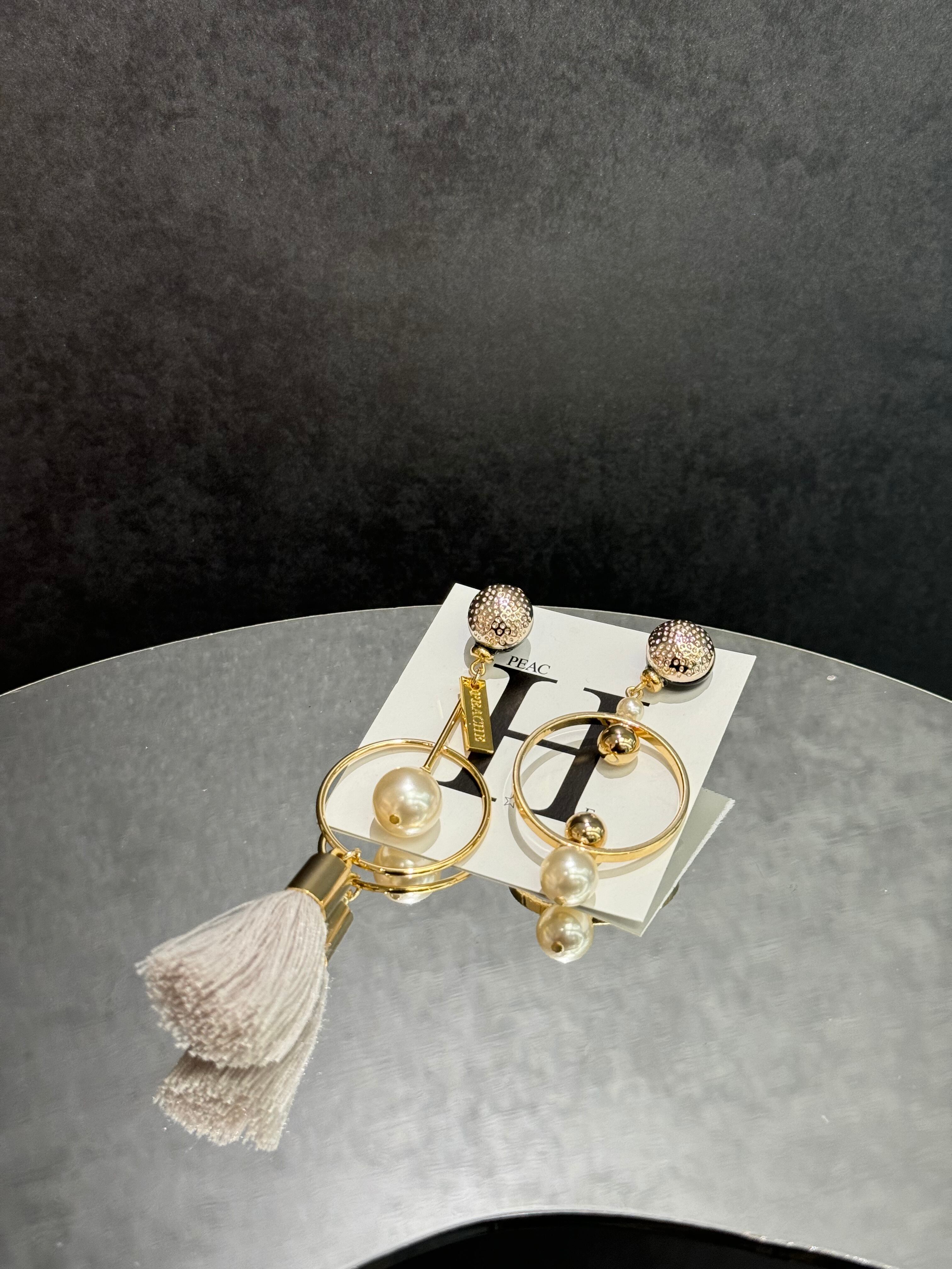 punching gold circle pearl tassel