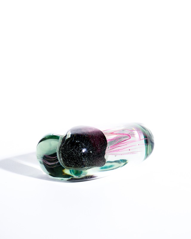 A paperweight object containing a glass jellyfish