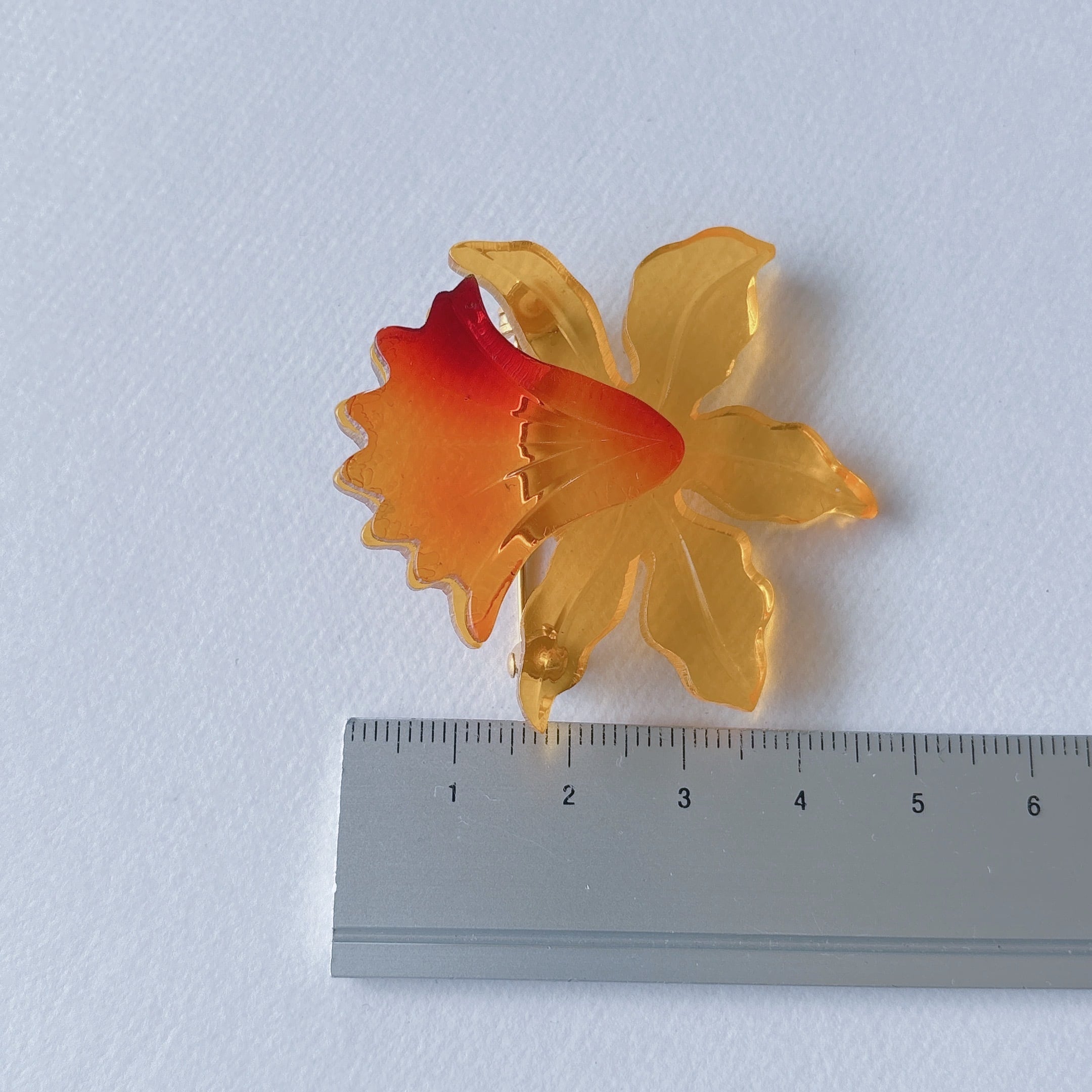 Vintage yellow orange amber acrylic plastic flower cattleya brooch