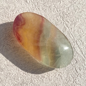 Candy fluorite palm stone
