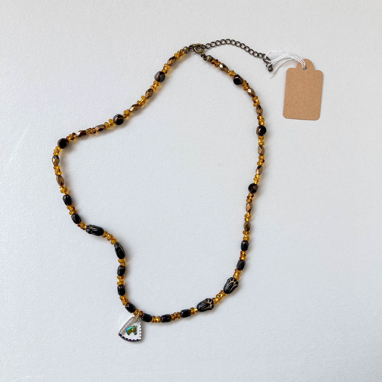 chii 虹色馬トップとブラックチューリップのネックレス | Dua