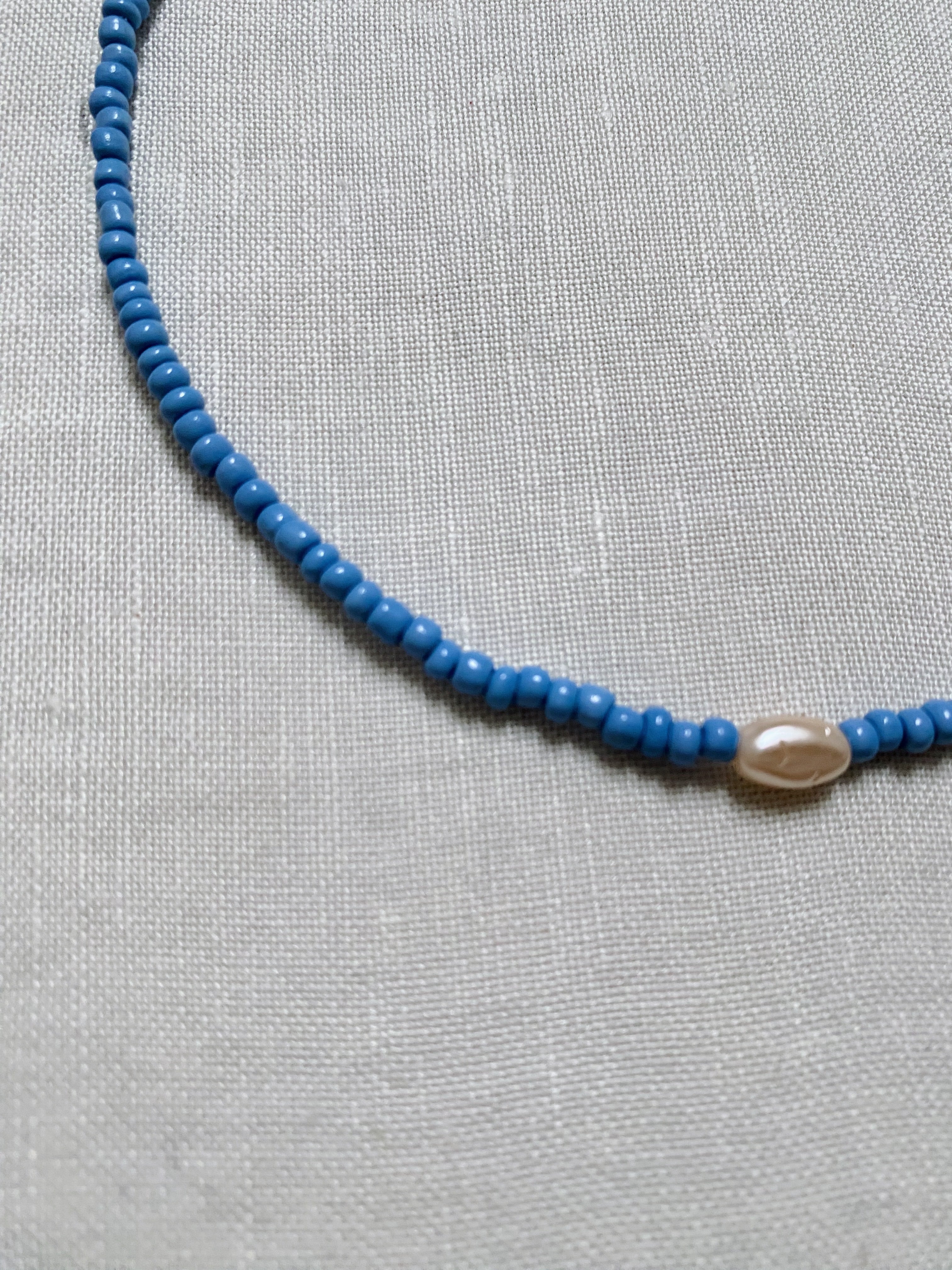 light blue seed glass necklace