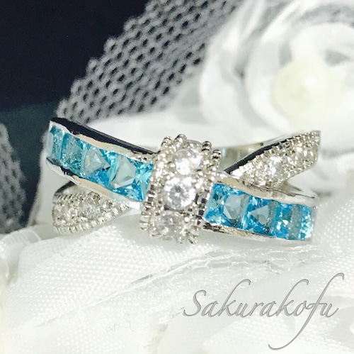 D015 ブルートパーズとキュービックジルコニア クロスリボンリング  Cross Ribbon Blue Topaz Ring