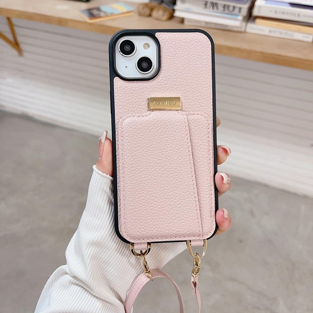 NanHou iPhone 15 Plus ケース 手帳型 高質PU(超繊皮革) ファッション手帳型 斜めショルダーストラップ付き（長さ調整可能）耐衝撃 保護iPhone 15 Plus カバー 内蔵 自吸式開閉 マグネット 背面鏡付き 人気 携帯カバー 女性 上品 カードポケット スタンド機能 リストバンド ケース - ピンク
