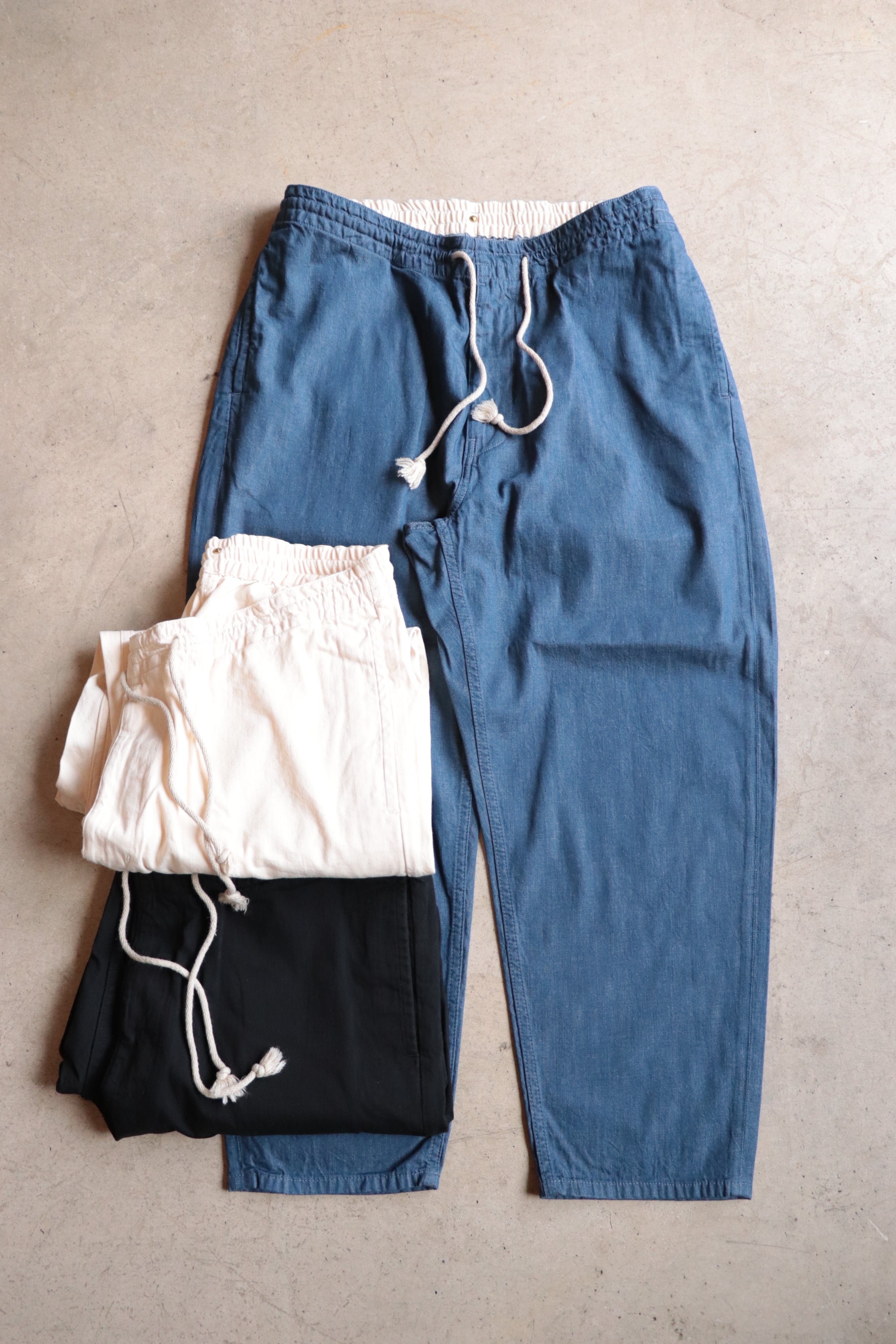 ANACHRONORM/アナクロノーム　DENIM TAPERED EASY PANTS　AN110