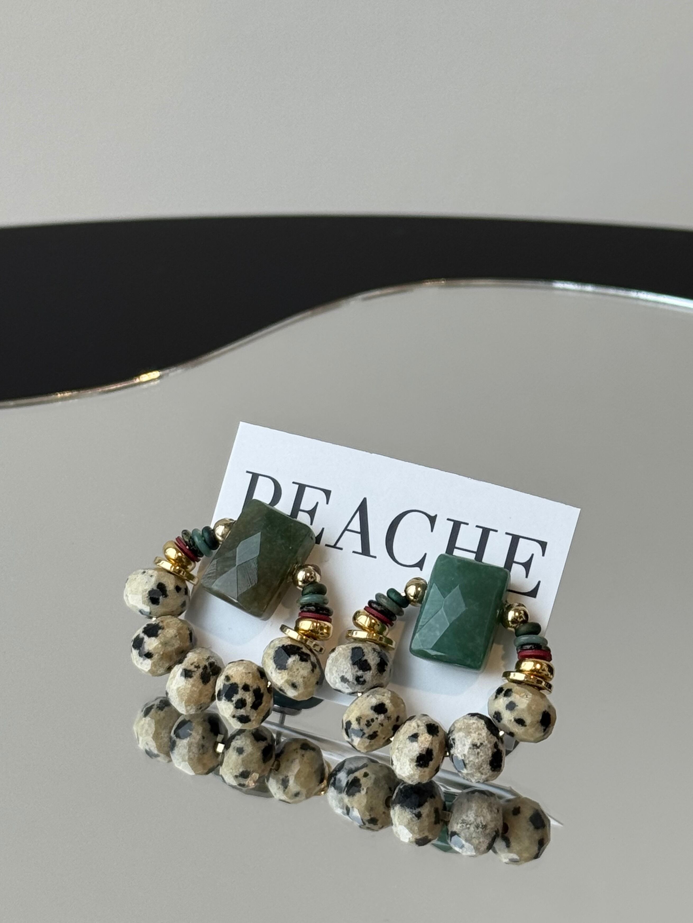 green stone dalmatian gold circle