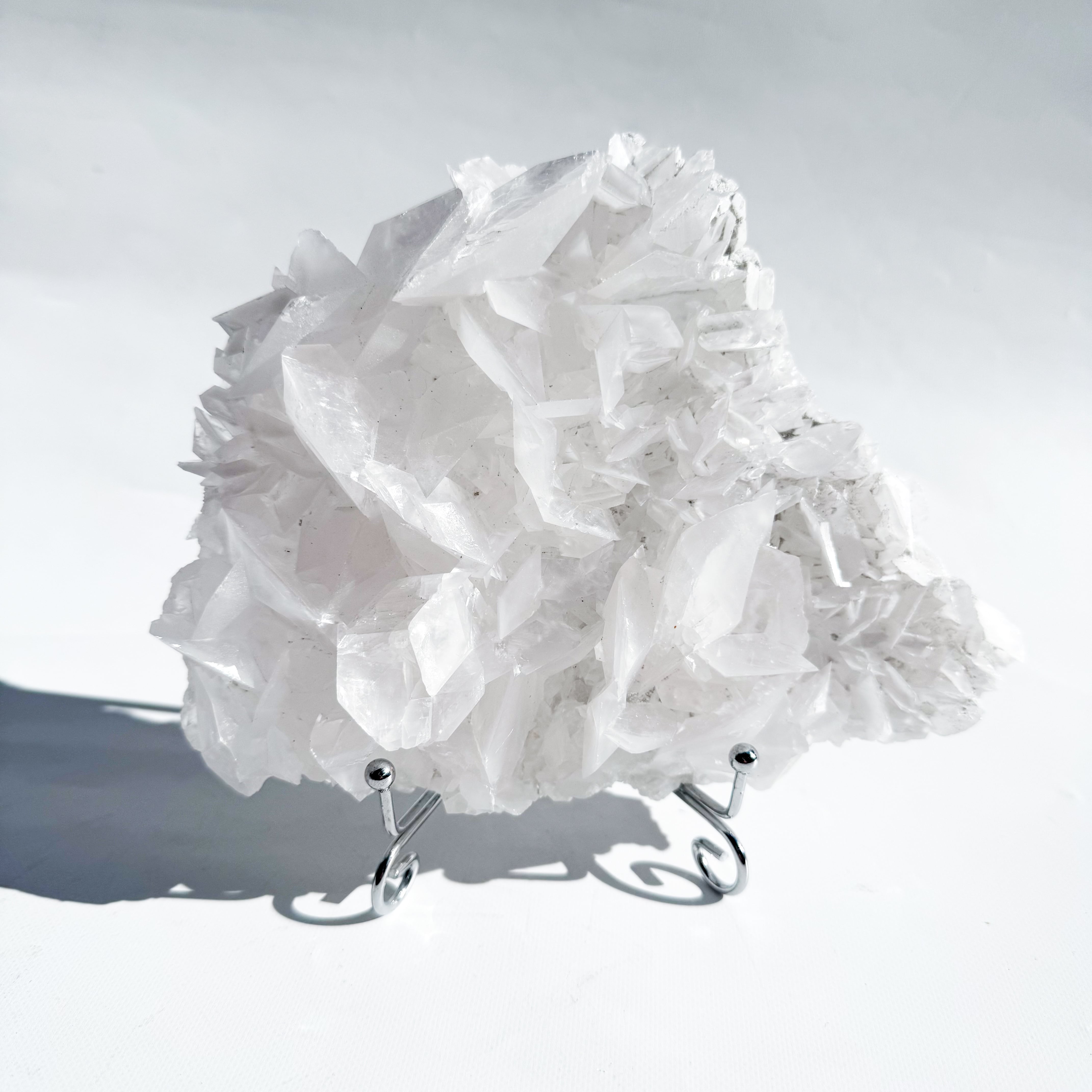 Glossy rose calcite with stand