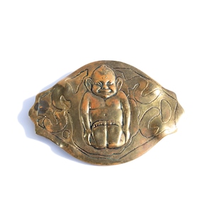 Vintage Billiken brass brooch