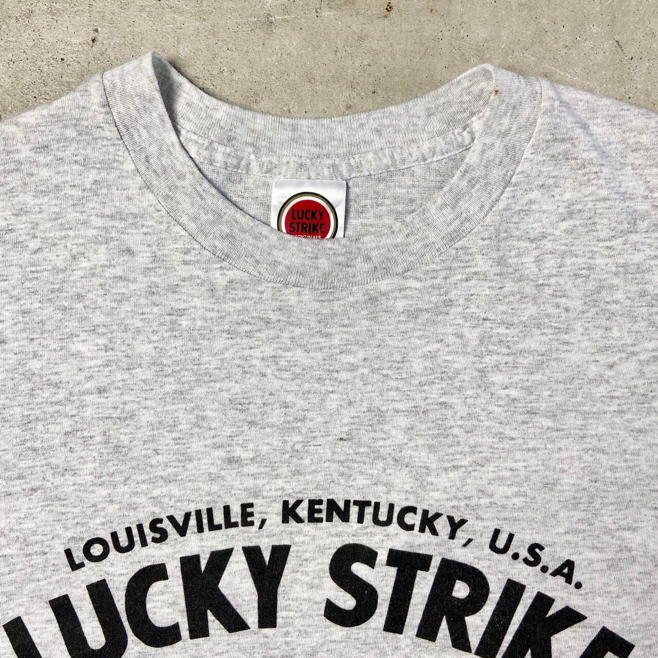 USA製 90年代 ”LUCKY STRIKE” 企業 オリジナル アドバタイジングTシャツ メンズM 古着 ラッキーストライク タバコ 煙草  プリントTシャツ 90s ヴィンテージ ビンテージ 袖シングルステッチ 霜降りグレー【Tシャツ】【SS2308-1】 | cave ...