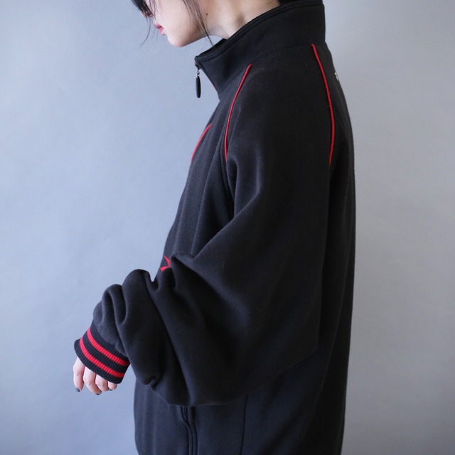 "Reebok" bi-color design over silhouette half-zip sweat pullover