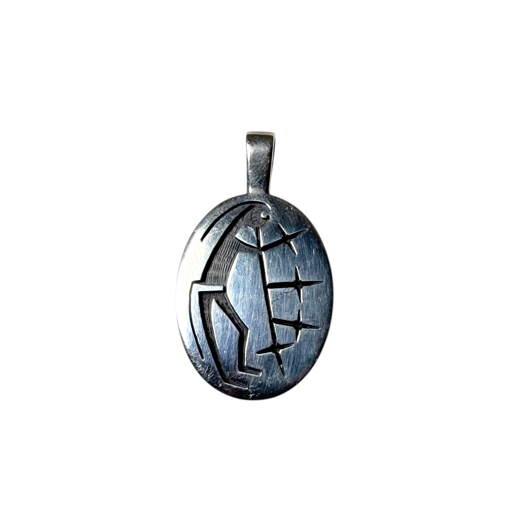 Hopi Ricky Coochwytewa silver overlay pendant “Starblowers” | NOIR