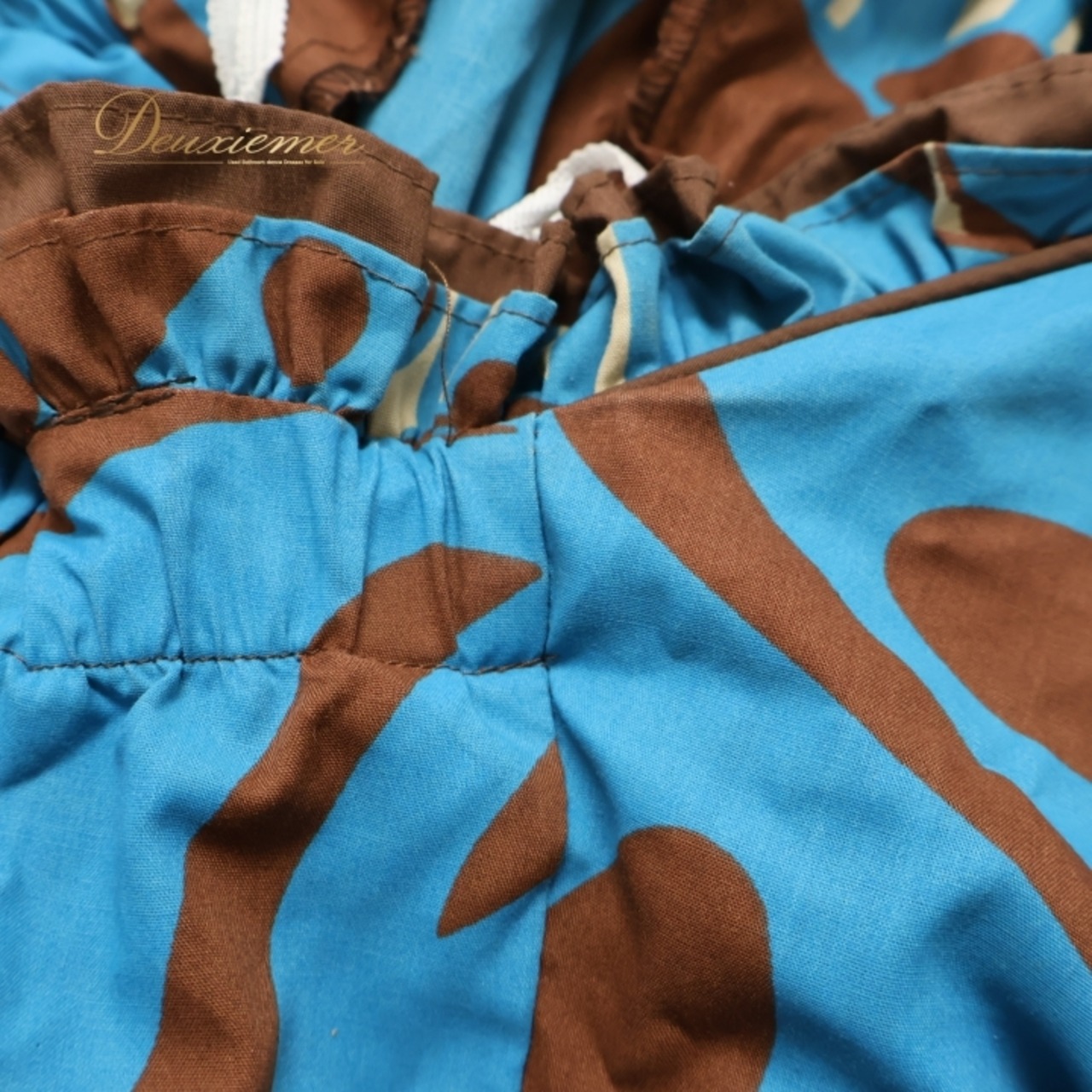 フラダンス 衣装 ワンピース ドレス ブラウン系 MAPUANA フラ ダンス フリル 茶 ターコイズブルー系 レフア柄 花柄 ハワイアン アロハ かわいい 華やか ハワイアンプリント ブルー系