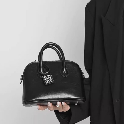 Mini faux leather handbag with charm tag C1355