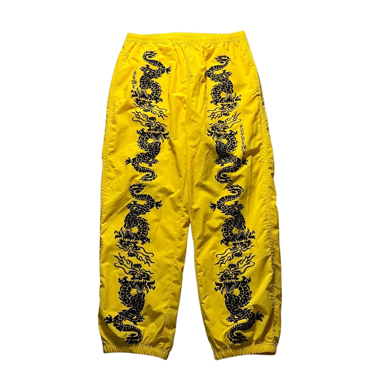 SUPREME dragon print nylon track pants