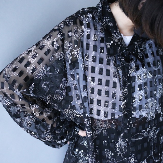 block and arabesque pattern XXX over silhouette see-through shirt