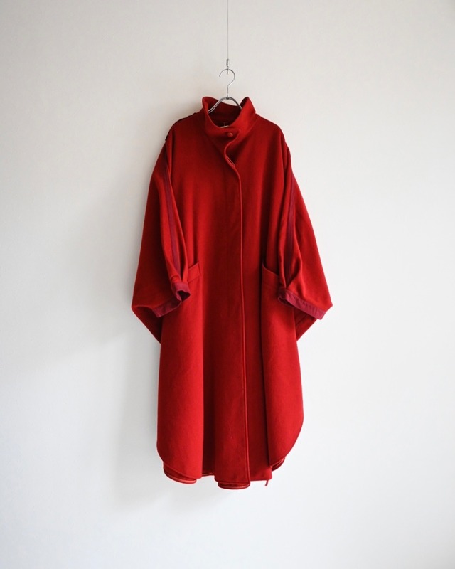 red poncho coat