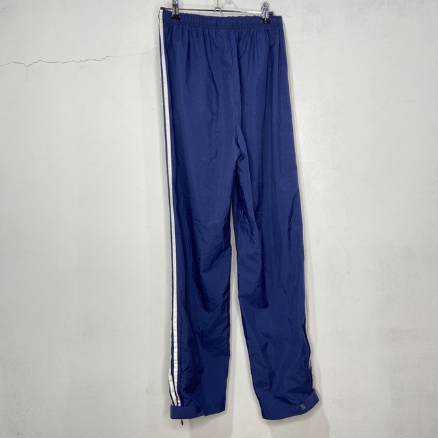 adidas ナイロントラックパンツ パフォーマンスロゴ スリーストライプ紺 L