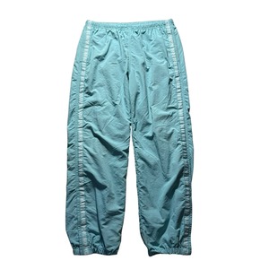 SUPREME logo taping track pants