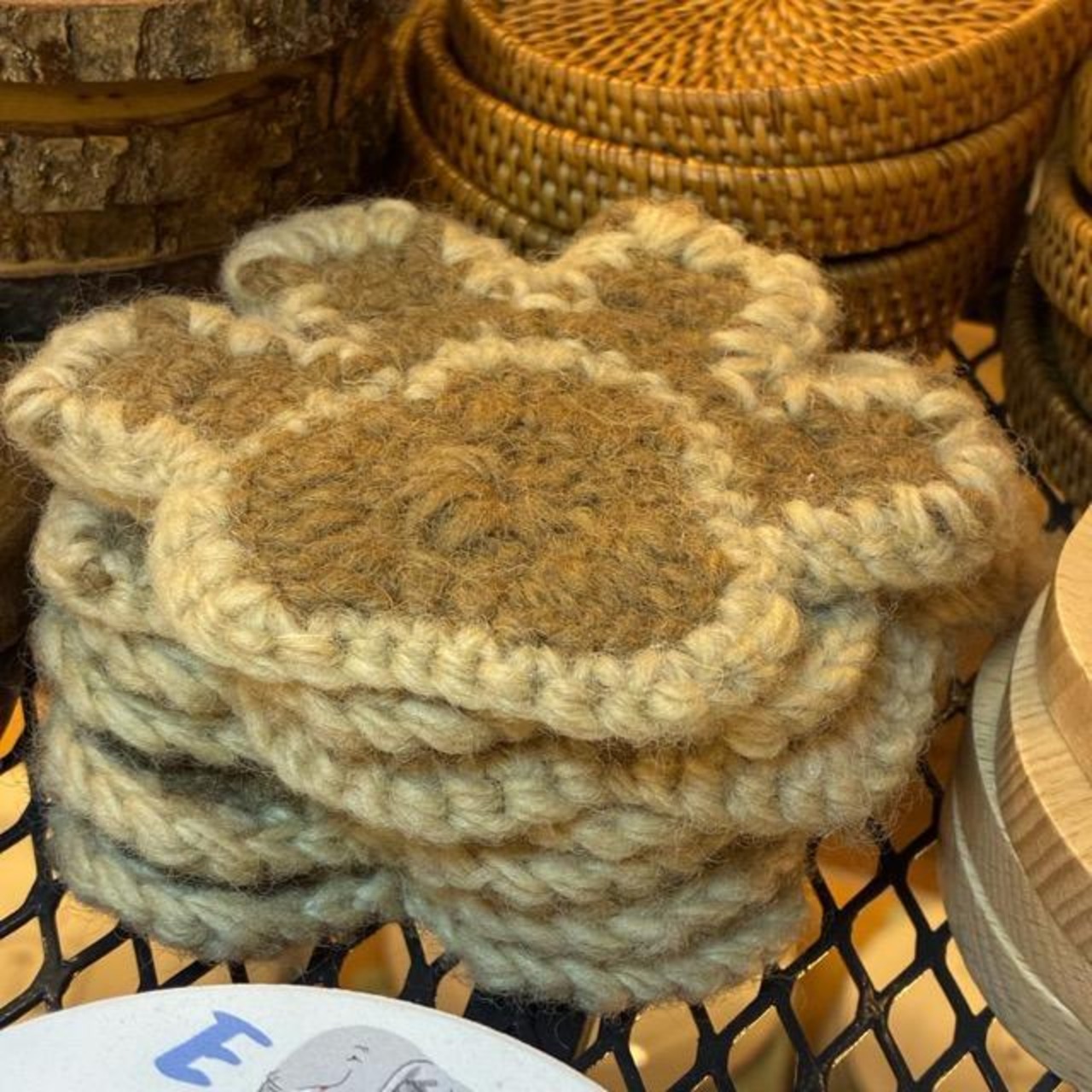 Nepal hand-knitted wool coaster Cat's Paw. A hand-knitted wool coaster with a cat's paw design. Perfect for kitchenware, glasses, coffee, or as a trivet.