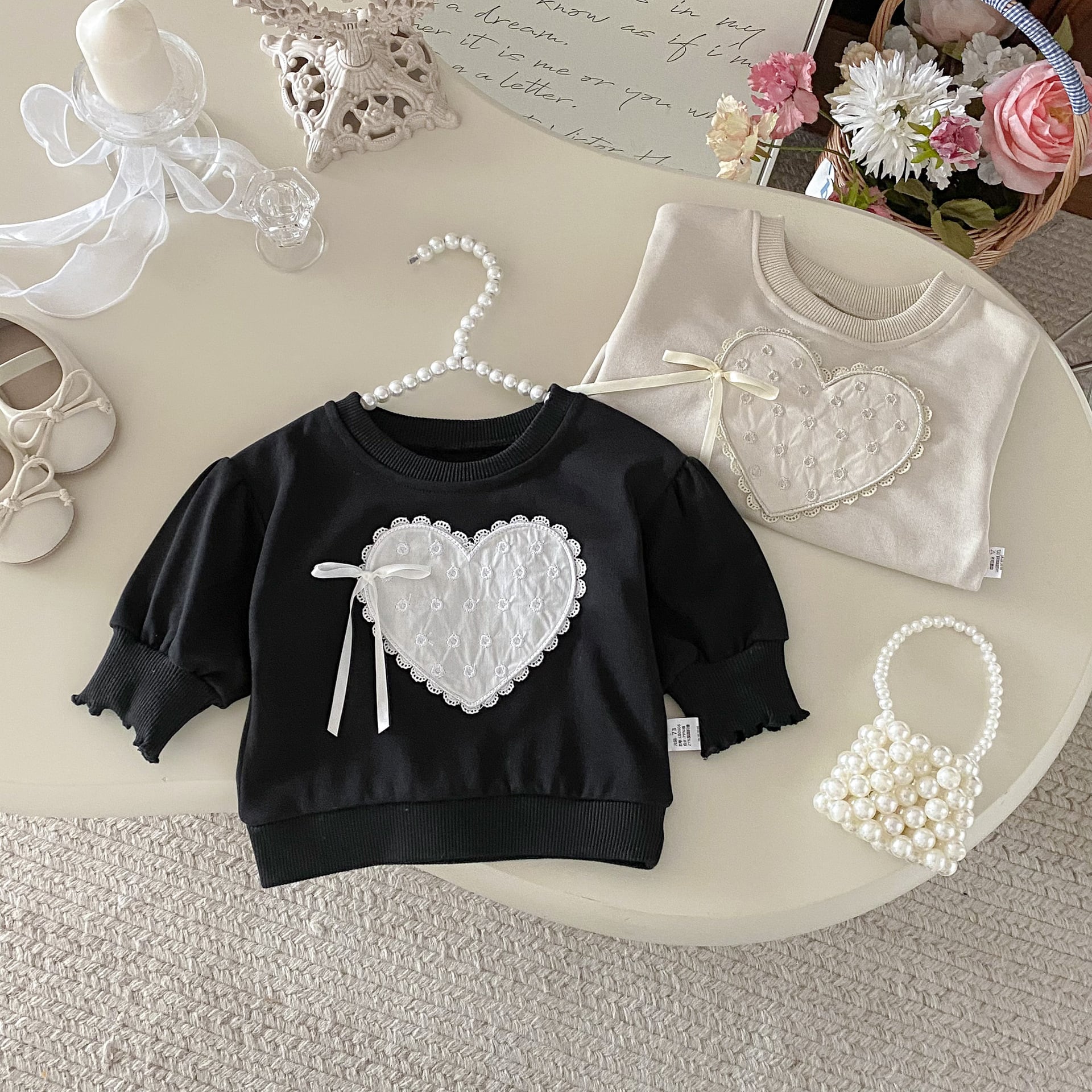 パフスリーブハートリボントレーナー