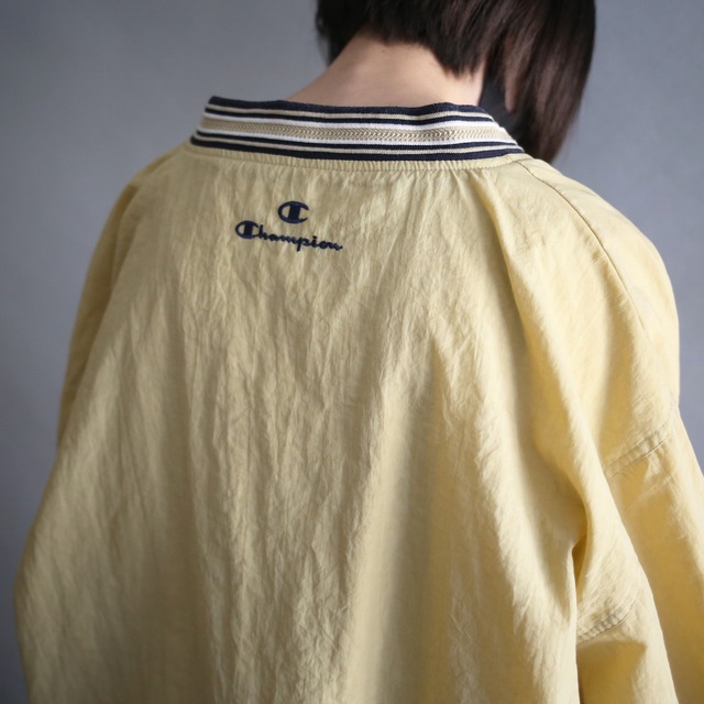 "Champion" knit rib design over silhouette yellow nylon pullover