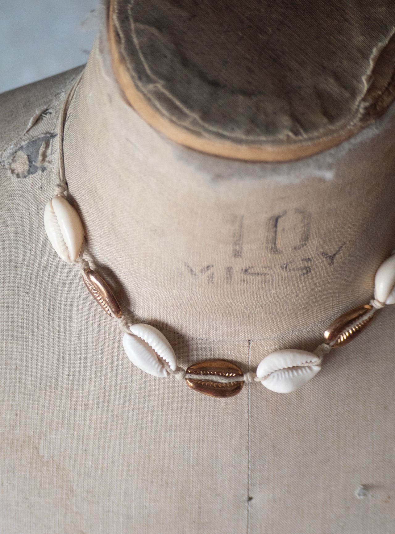 unknown used Cowrie and brass necklace