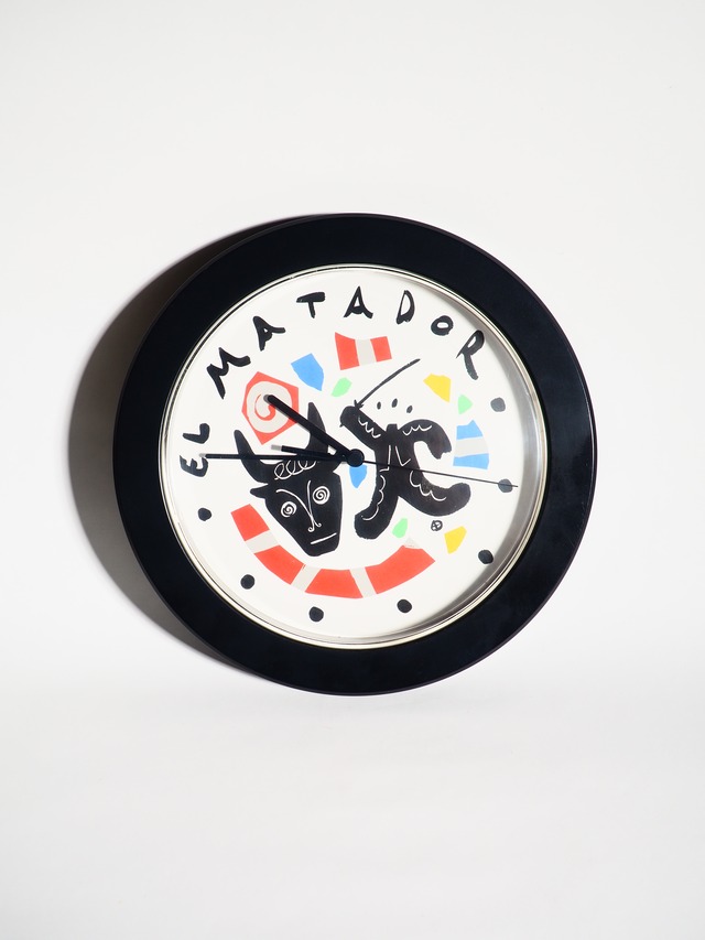 Wall clock depicting a bull and a matador